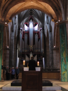 The presbyter in St. Giles' Cathedral with the organ in front of her.
